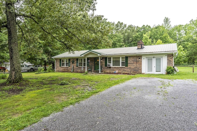 1390 Ky Highway 698, Stanford, KY 40484 - ranch-style home with a chimney, brick siding, a front yard, a metal roof, and covered porch