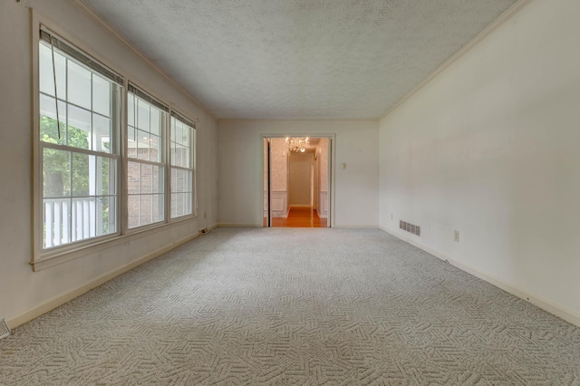230 Fairway Dr, Nicholasville, KY 40356 - unfurnished room with carpet, a textured ceiling, a chandelier, and ornamental molding
