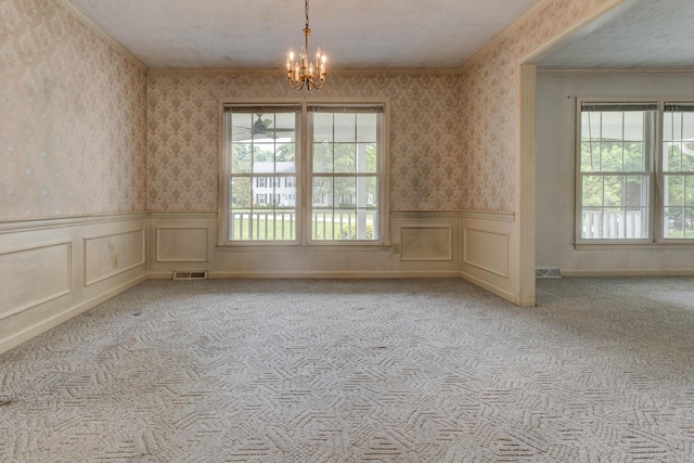 230 Fairway Dr, Nicholasville, KY 40356 - unfurnished room with wallpapered walls, a chandelier, carpet flooring, wainscoting, and crown molding