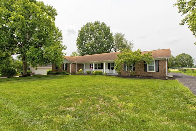230 Fairway Dr, Nicholasville, KY 40356 - single story home with covered porch, brick siding, and a front yard