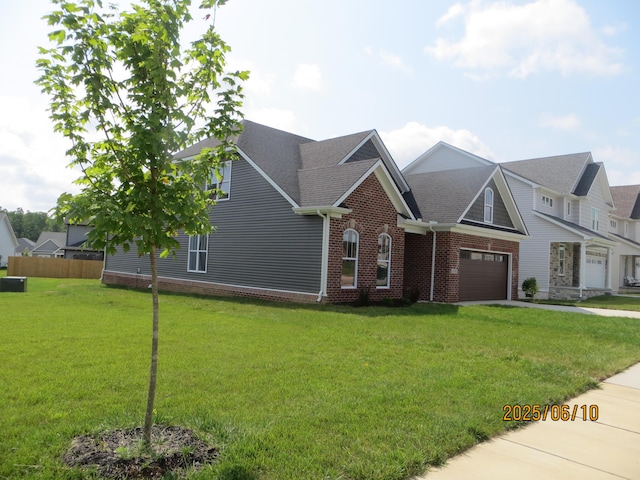 1210 Twilight Shadow Dr, Lexington, KY 40509 - view of front of house featuring a garage, brick siding, concrete driveway, a shingled roof, and a front yard