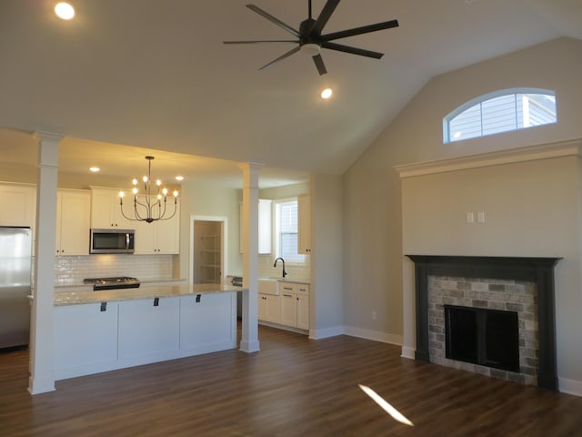 1210 Twilight Shadow Dr, Lexington, KY 40509 - kitchen featuring stainless steel appliances, decorative columns, a fireplace, tasteful backsplash, and recessed lighting