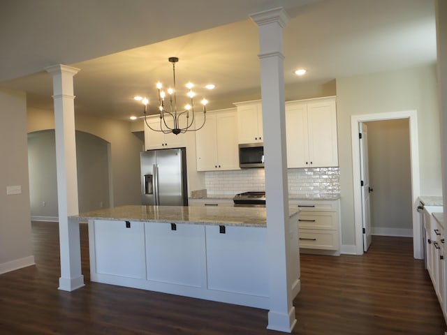 1210 Twilight Shadow Dr, Lexington, KY 40509 - kitchen featuring appliances with stainless steel finishes, ornate columns, decorative backsplash, recessed lighting, and dark wood-style flooring