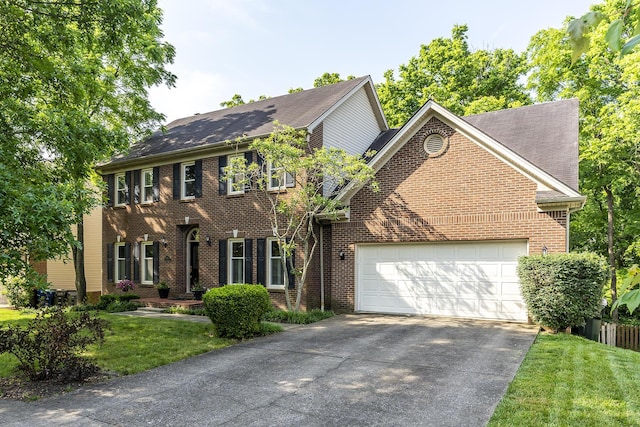 768 Emmett Creek Ln, Lexington, KY 40515 - colonial-style house with brick siding, a garage, driveway, and a front lawn