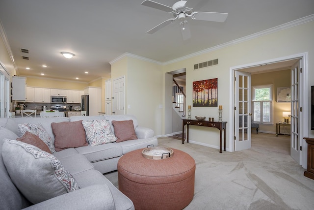 768 Emmett Creek Ln, Lexington, KY 40515 - living area with ornamental molding, light colored carpet, stairway, ceiling fan, and french doors