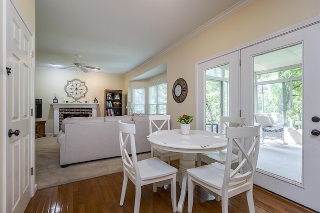 768 Emmett Creek Ln, Lexington, KY 40515 - dining area with a ceiling fan, ornamental molding, wood finished floors, and a brick fireplace