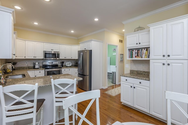 768 Emmett Creek Ln, Lexington, KY 40515 - kitchen with stainless steel appliances, a peninsula, decorative backsplash, stone counters, and crown molding
