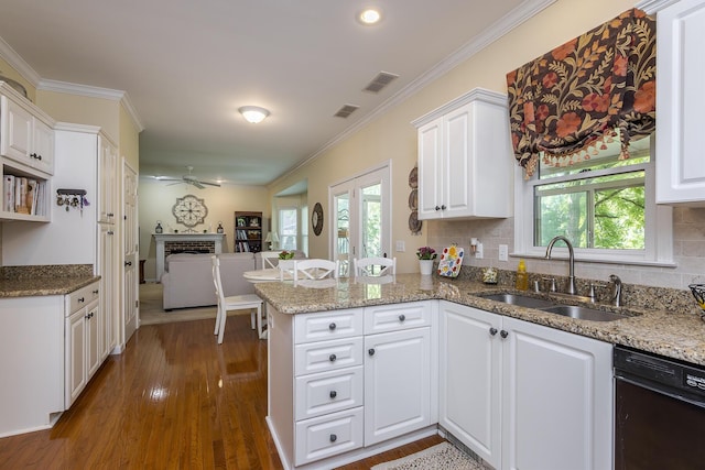 768 Emmett Creek Ln, Lexington, KY 40515 - kitchen featuring black dishwasher, a fireplace, a peninsula, white cabinets, and crown molding