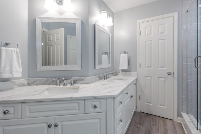 768 Emmett Creek Ln, Lexington, KY 40515 - bathroom with double vanity, wood finished floors, and tiled shower