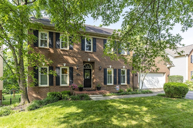 768 Emmett Creek Ln, Lexington, KY 40515 - colonial-style house featuring brick siding, a front yard, and a garage