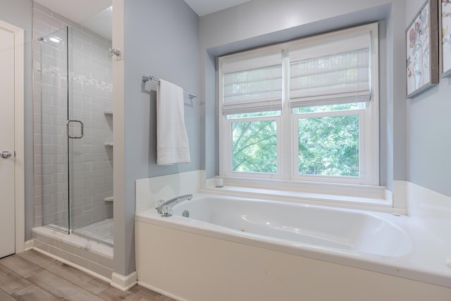 768 Emmett Creek Ln, Lexington, KY 40515 - bathroom with a stall shower, a bath, and wood finished floors