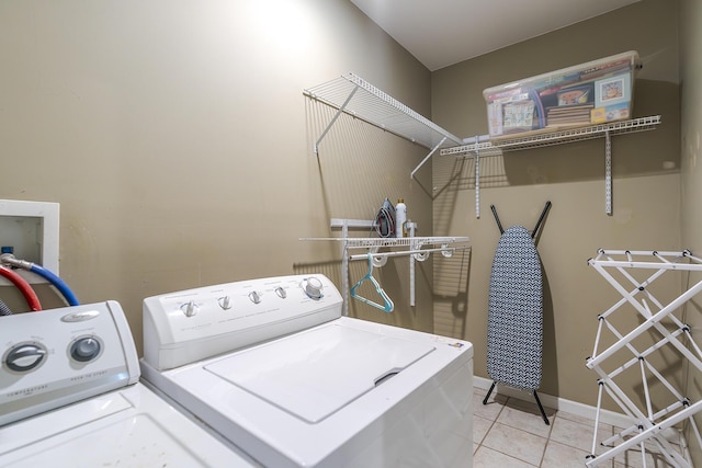 768 Emmett Creek Ln, Lexington, KY 40515 - laundry area with washer and dryer and light tile patterned floors