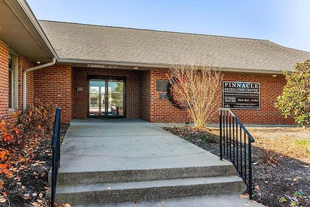 768 Emmett Creek Ln, Lexington, KY 40515 - property entrance featuring a shingled roof and brick siding