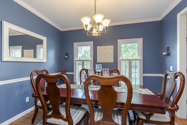 768 Emmett Creek Ln, Lexington, KY 40515 - dining room with a chandelier, healthy amount of natural light, crown molding, and wood finished floors