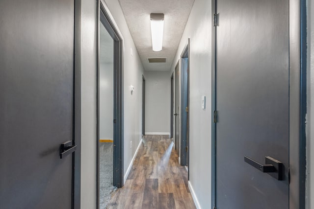 15 Conlee Ln, Stanton, KY 40380 - corridor featuring a textured ceiling, wood finished floors, and baseboards
