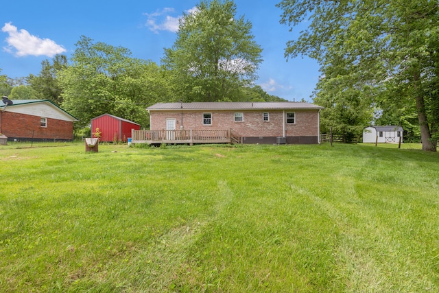 15 Conlee Ln, Stanton, KY 40380 - rear view of house with a deck, brick siding, and central AC unit
