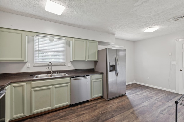 15 Conlee Ln, Stanton, KY 40380 - kitchen with appliances with stainless steel finishes, green cabinetry, a sink, dark countertops, and dark wood-style flooring