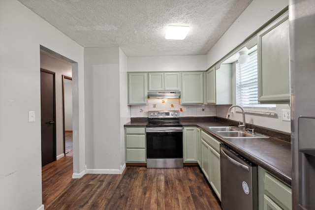 15 Conlee Ln, Stanton, KY 40380 - kitchen with appliances with stainless steel finishes, under cabinet range hood, a sink, dark countertops, and green cabinets