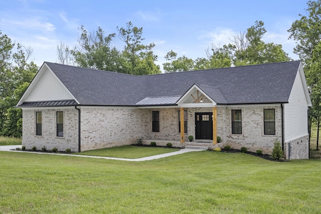 437 Boones Creek Rd, Lancaster, KY 40444 - modern farmhouse featuring a front yard, brick siding, a shingled roof, and a standing seam roof