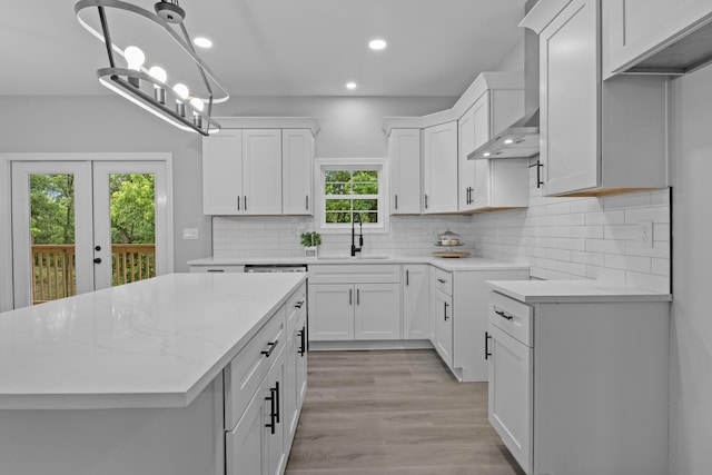 437 Boones Creek Rd, Lancaster, KY 40444 - kitchen with a sink, recessed lighting, tasteful backsplash, white cabinets, and a kitchen island