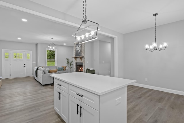 437 Boones Creek Rd, Lancaster, KY 40444 - kitchen with recessed lighting, light wood-style floors, a chandelier, white cabinetry, and hanging light fixtures