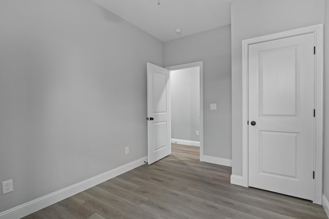 437 Boones Creek Rd, Lancaster, KY 40444 - unfurnished bedroom featuring wood finished floors and baseboards