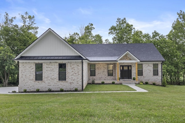 437 Boones Creek Rd, Lancaster, KY 40444 - view of front facade featuring a front lawn, a standing seam roof, brick siding, metal roof, and a shingled roof
