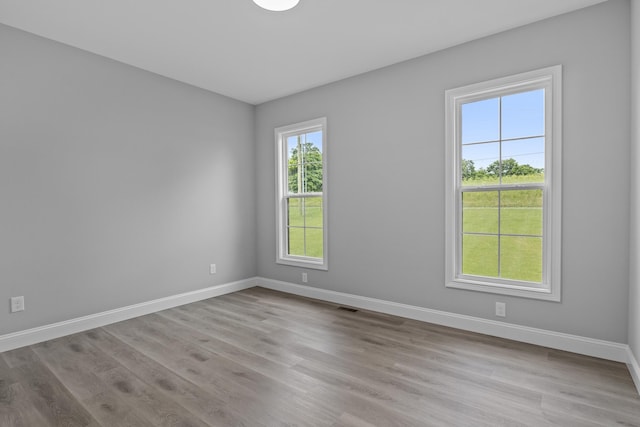 437 Boones Creek Rd, Lancaster, KY 40444 - empty room with healthy amount of natural light, baseboards, and wood finished floors
