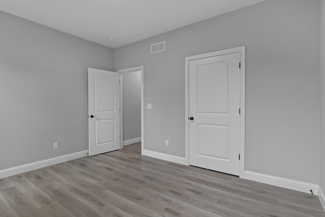 437 Boones Creek Rd, Lancaster, KY 40444 - unfurnished bedroom with wood finished floors and baseboards