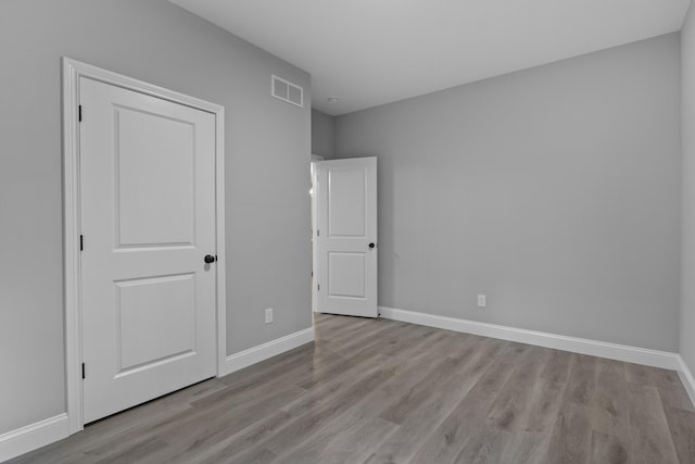 437 Boones Creek Rd, Lancaster, KY 40444 - unfurnished bedroom featuring baseboards and wood finished floors