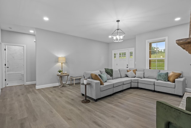 437 Boones Creek Rd, Lancaster, KY 40444 - living room with baseboards, light wood finished floors, recessed lighting, and a chandelier