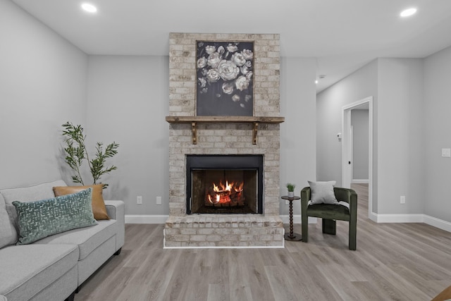 437 Boones Creek Rd, Lancaster, KY 40444 - living room featuring wood finished floors, a brick fireplace, recessed lighting, and baseboards