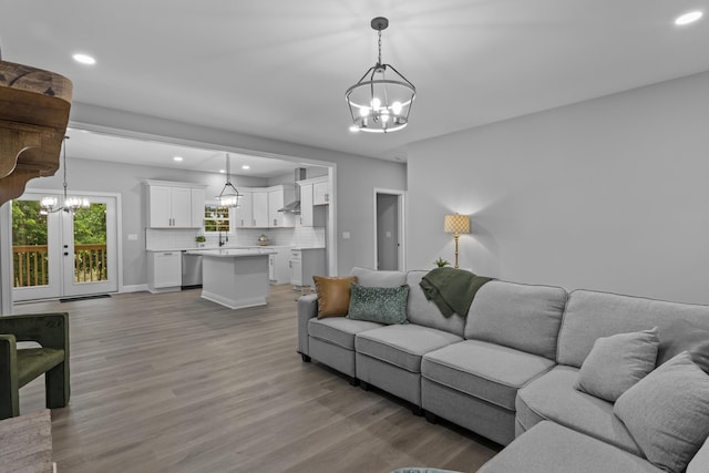 437 Boones Creek Rd, Lancaster, KY 40444 - living room with a chandelier, recessed lighting, light wood-style flooring, french doors, and baseboards