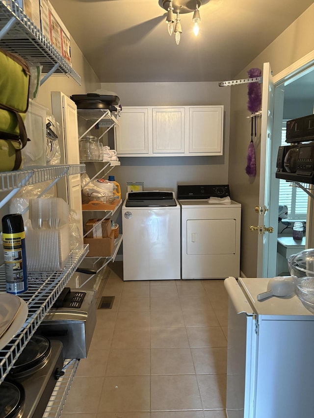 260 Beech Fork Blvd, Clay City, KY 40312 - washroom featuring washer and clothes dryer, light tile patterned floors, and cabinet space