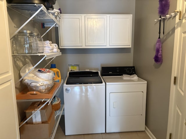 260 Beech Fork Blvd, Clay City, KY 40312 - washroom featuring cabinet space, washing machine and dryer, and light tile patterned floors