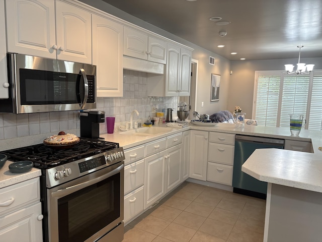 260 Beech Fork Blvd, Clay City, KY 40312 - kitchen featuring stainless steel appliances, white cabinets, light tile patterned flooring, a chandelier, and tasteful backsplash