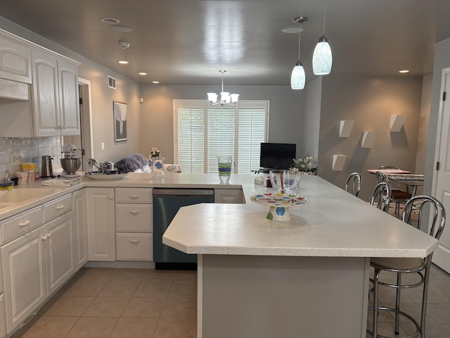 260 Beech Fork Blvd, Clay City, KY 40312 - kitchen featuring dishwasher, light tile patterned floors, a chandelier, a breakfast bar, and light countertops