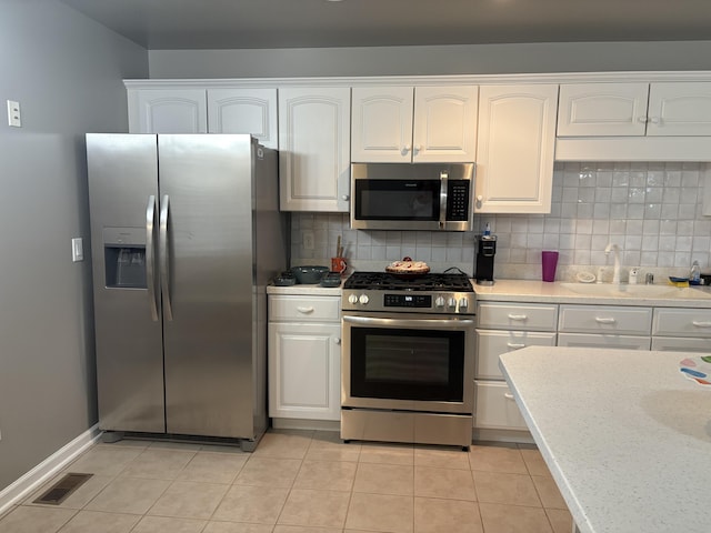 260 Beech Fork Blvd, Clay City, KY 40312 - kitchen featuring appliances with stainless steel finishes, white cabinetry, and tasteful backsplash