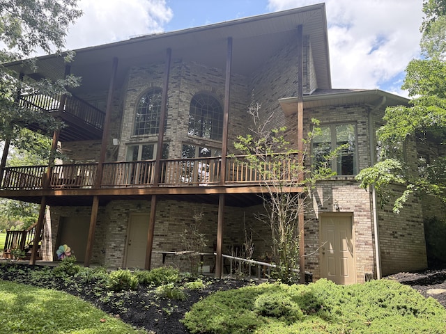 260 Beech Fork Blvd, Clay City, KY 40312 - rear view of house with brick siding, a wooden deck, and a balcony