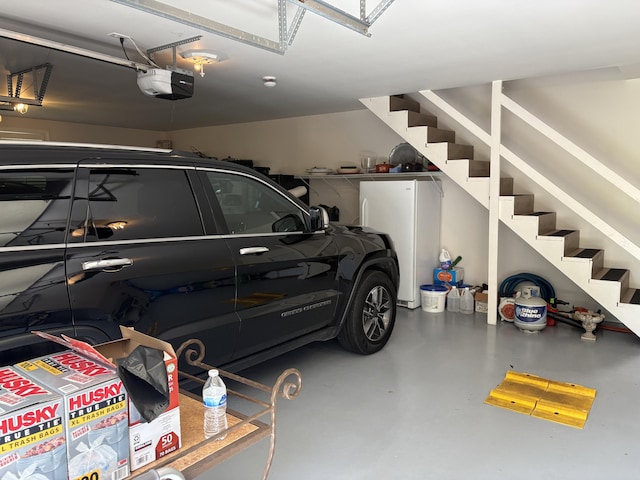260 Beech Fork Blvd, Clay City, KY 40312 - garage featuring a garage door opener and freestanding refrigerator