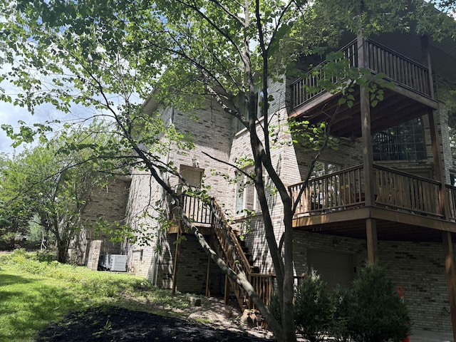 260 Beech Fork Blvd, Clay City, KY 40312 - rear view of house featuring brick siding, a wooden deck, and stairs
