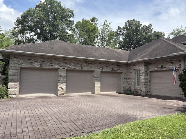 260 Beech Fork Blvd, Clay City, KY 40312 - view of front of house with brick siding, a shingled roof, decorative driveway, and an attached garage