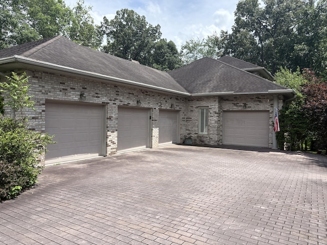 260 Beech Fork Blvd, Clay City, KY 40312 - view of front of house with brick siding, decorative driveway, roof with shingles, and a garage