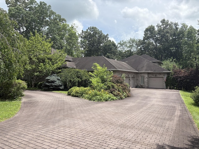 260 Beech Fork Blvd, Clay City, KY 40312 - view of front of house featuring a garage, decorative driveway, and view of wooded area
