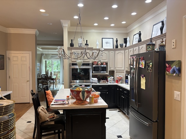 260 Beech Fork Blvd, Clay City, KY 40312 - kitchen featuring appliances with stainless steel finishes, light tile patterned flooring, crown molding, a center island, and a chandelier