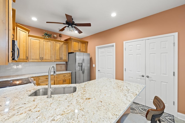 111 Acorn Path, Georgetown, KY 40324 - kitchen with appliances with stainless steel finishes, ceiling fan, light stone counters, recessed lighting, and brown cabinetry