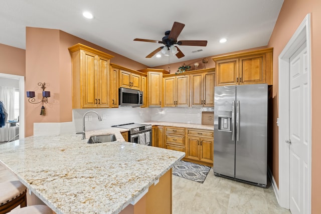 111 Acorn Path, Georgetown, KY 40324 - kitchen featuring stainless steel appliances, a peninsula, a ceiling fan, backsplash, and a breakfast bar area