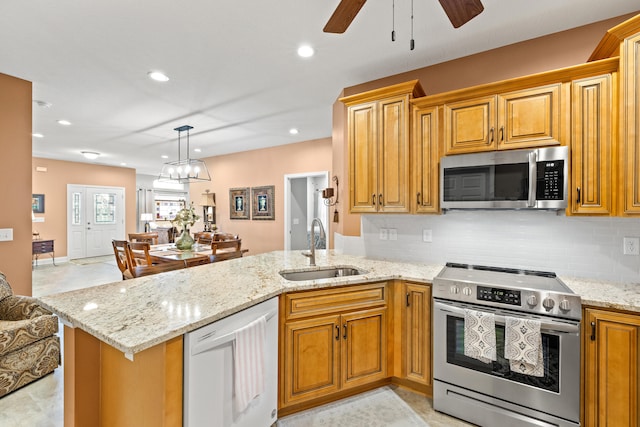 111 Acorn Path, Georgetown, KY 40324 - kitchen with stainless steel appliances, a peninsula, backsplash, light stone countertops, and recessed lighting