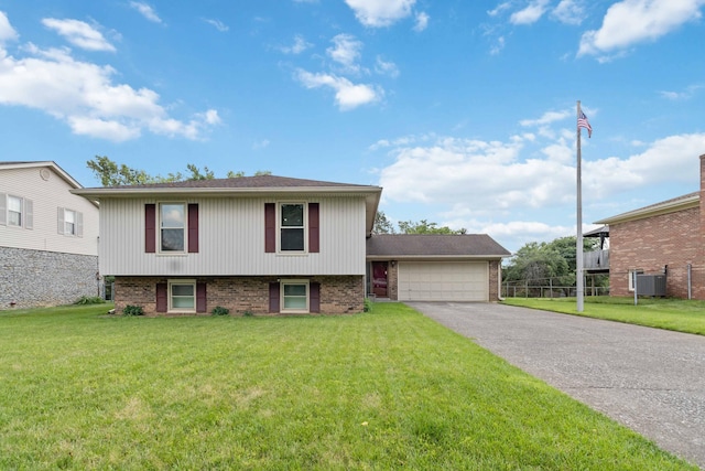 3852 Heimbaugh Ln, Lexington, KY 40514 - tri-level home featuring brick siding, a garage, and driveway