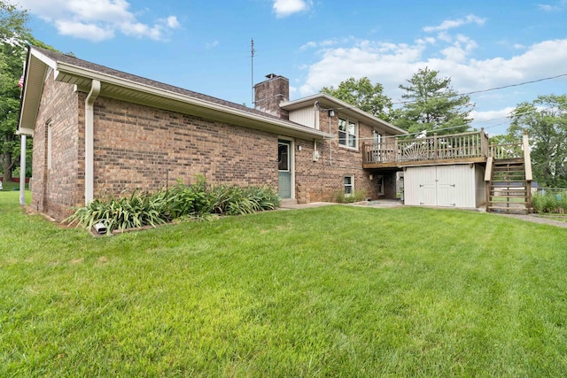 3852 Heimbaugh Ln, Lexington, KY 40514 - back of property featuring brick siding, a chimney, a deck, a yard, and stairway